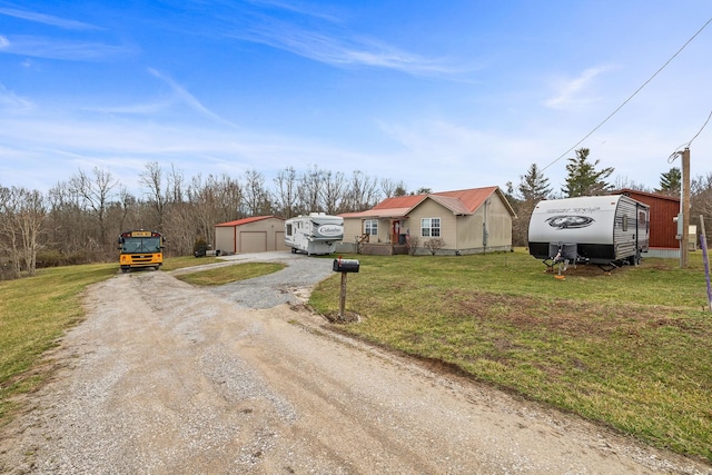 126 Andrea Ln, Monterey, TN 38574 - view of front of house featuring a garage, a front yard, driveway, and an outdoor structure
