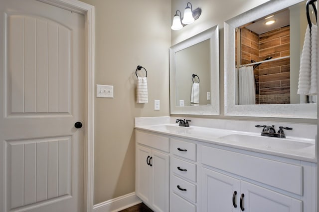 bathroom with vanity and curtained shower