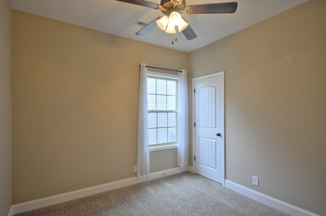 empty room with carpet flooring and ceiling fan