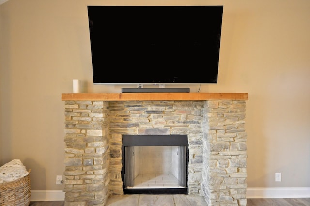 interior details with a fireplace and hardwood / wood-style floors