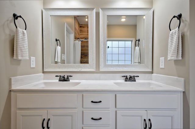 bathroom with vanity and walk in shower