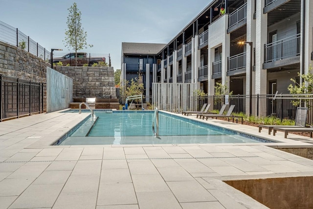 view of pool featuring a patio area