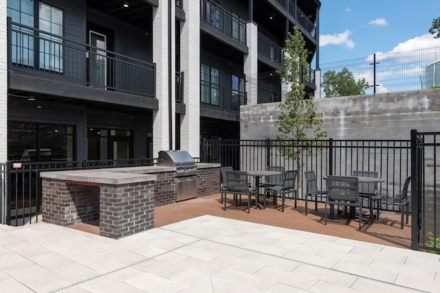 view of patio with a grill and exterior kitchen