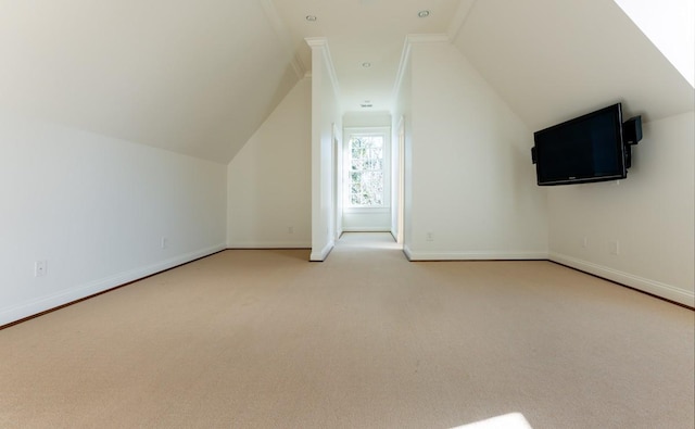 additional living space featuring carpet and lofted ceiling