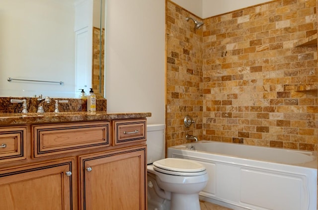 full bathroom featuring tile patterned flooring, vanity, toilet, and tiled shower / bath