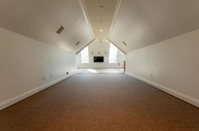 additional living space with carpet floors and lofted ceiling