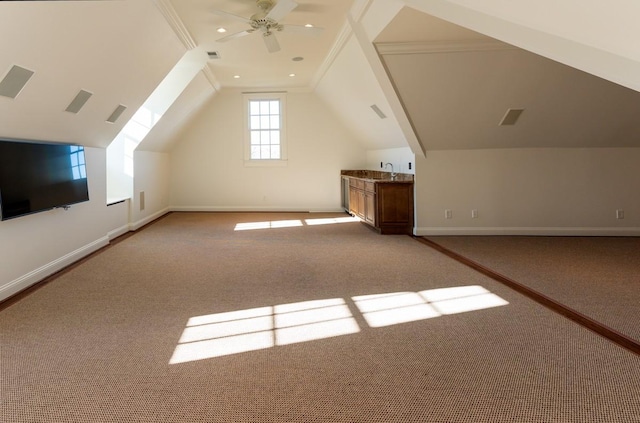 additional living space featuring light carpet, ceiling fan, lofted ceiling, and sink