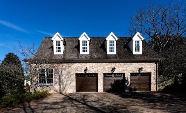 view of side of home featuring a garage