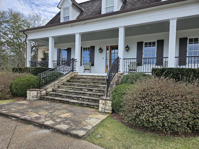 doorway to property featuring covered porch