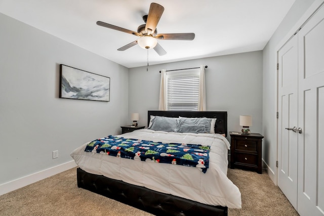 bedroom featuring light carpet, ceiling fan, and baseboards