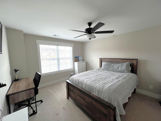 bedroom with baseboards, ceiling fan, visible vents, and light colored carpet