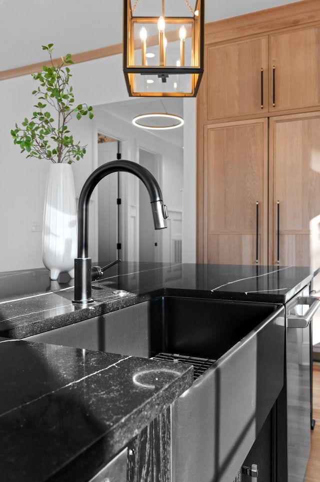 room details with dark stone countertops and stainless steel range with electric stovetop