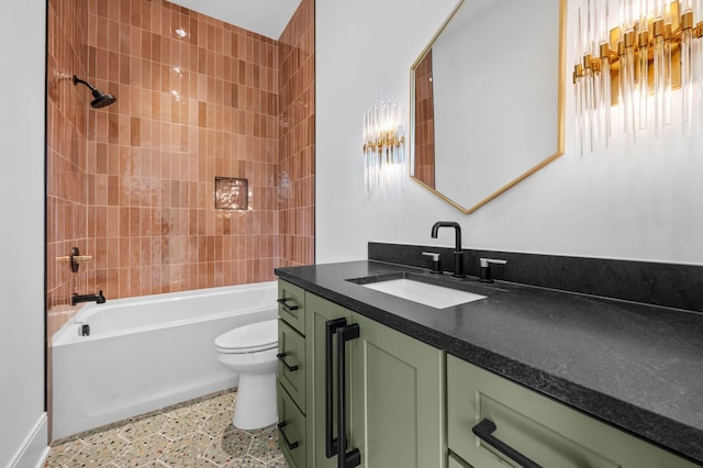 full bathroom featuring tiled shower / bath combo, vanity, and toilet