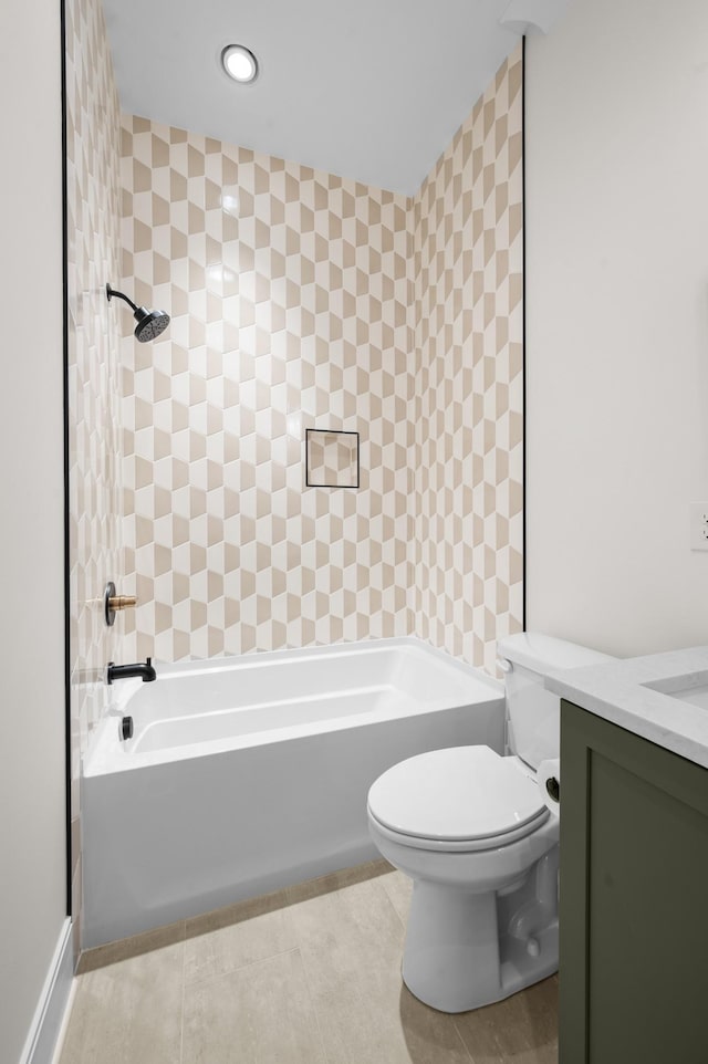 full bathroom with tiled shower / bath combo, vanity, toilet, and tile patterned floors