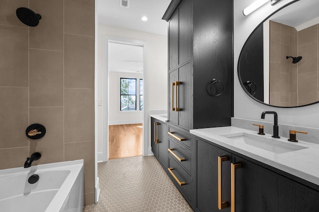 bathroom with shower / bath combination and vanity