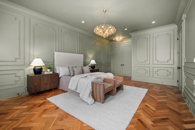 bedroom featuring an inviting chandelier and light parquet flooring