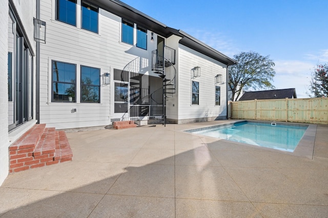 view of swimming pool with a patio area