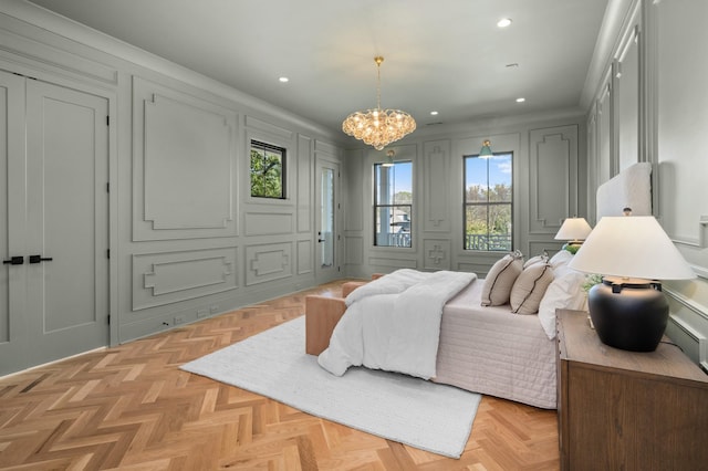 bedroom with a chandelier and light parquet floors