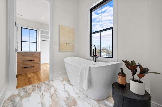 bathroom featuring a washtub