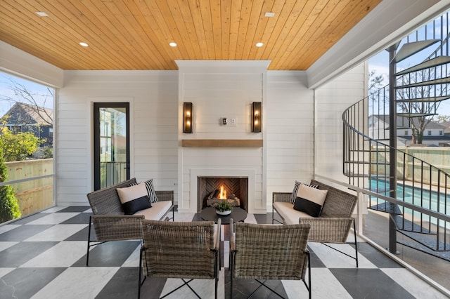 view of patio / terrace featuring an outdoor living space with a fireplace