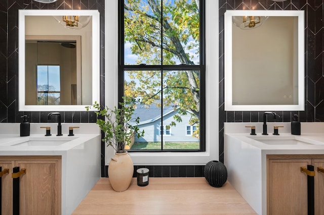 bathroom featuring tasteful backsplash and vanity