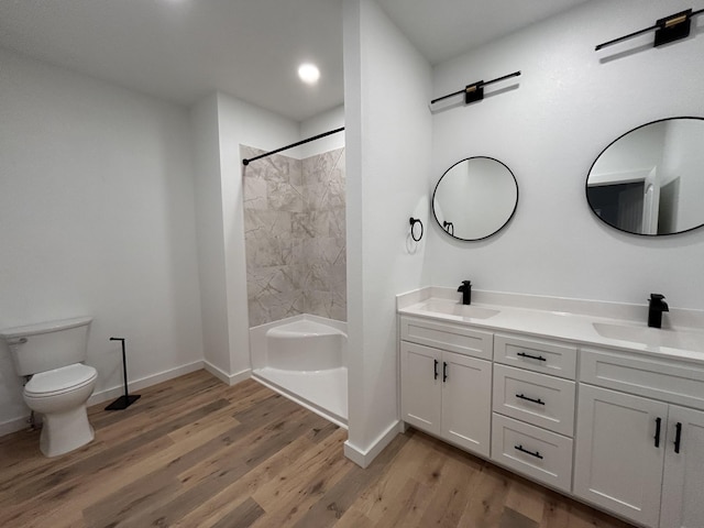 bathroom featuring hardwood / wood-style floors, vanity, and toilet