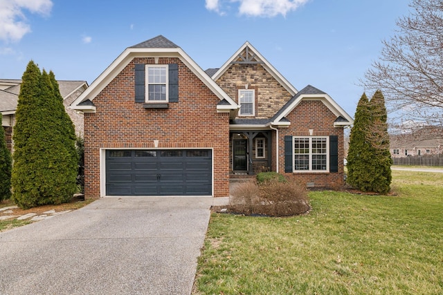 traditional-style house featuring a garage, a shingled roof, concrete driveway, a front lawn, and brick siding