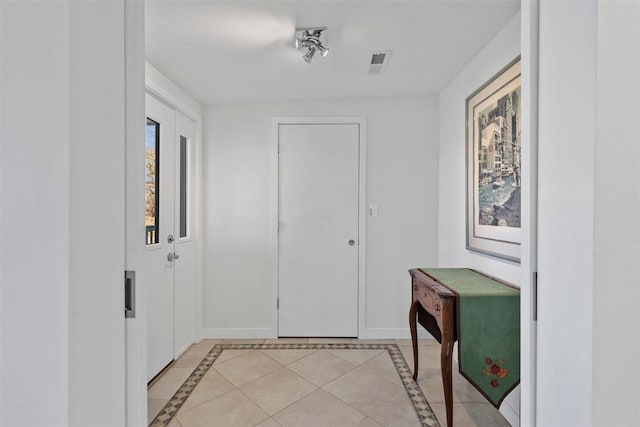 entrance foyer with light tile patterned floors