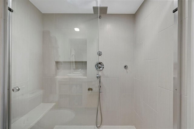 bathroom featuring tiled shower