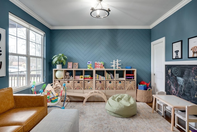 game room featuring a wealth of natural light and crown molding