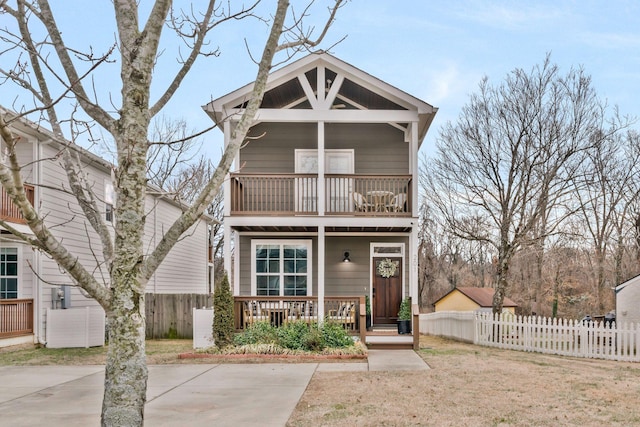 view of front facade featuring a balcony and a porch