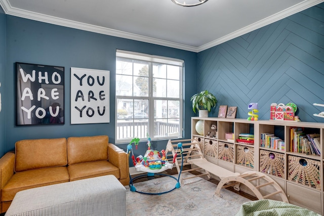 recreation room featuring a wealth of natural light and crown molding