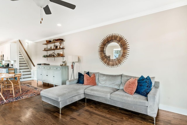 living room featuring ceiling fan, dark hardwood / wood-style floors, and ornamental molding