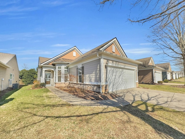 view of front of property with central AC unit, a garage, and a front lawn