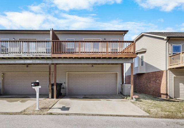 view of front of home with a garage and a balcony