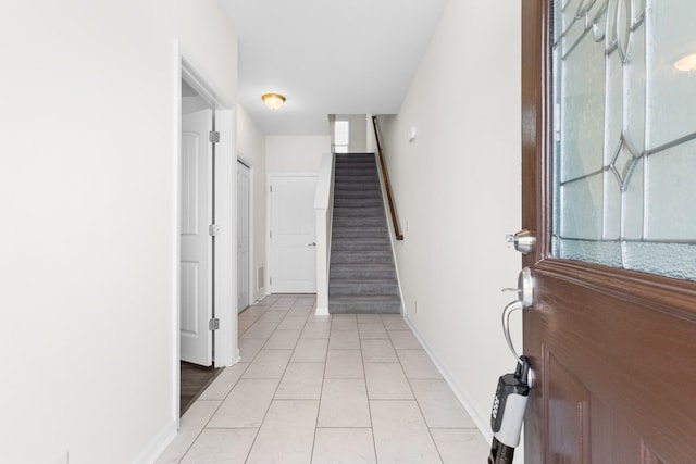 foyer with light tile patterned floors