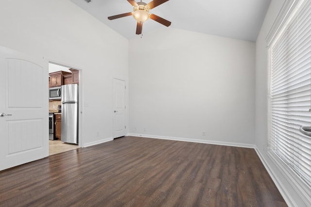 empty room featuring ceiling fan, high vaulted ceiling, and dark hardwood / wood-style flooring