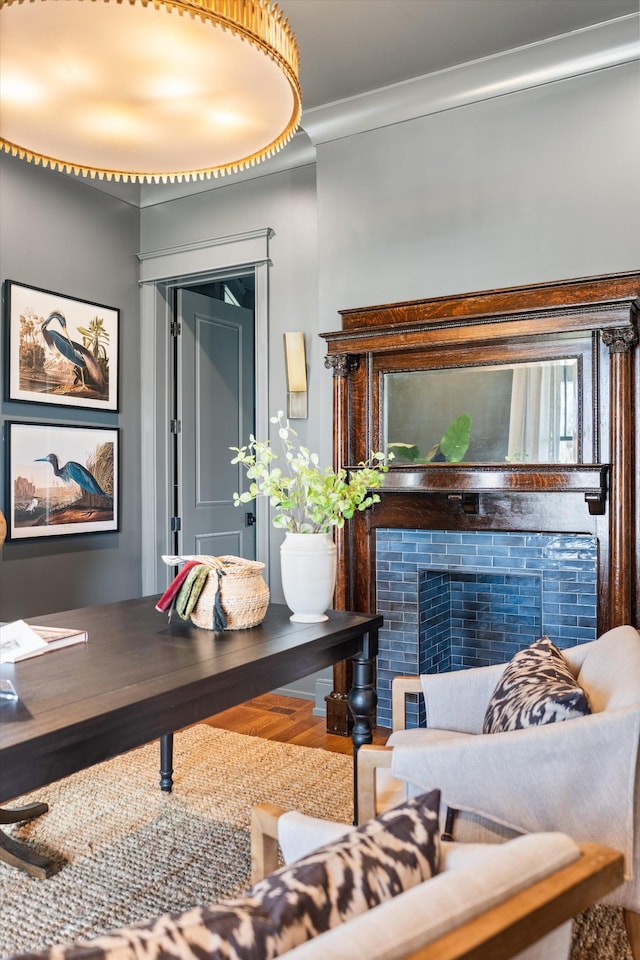 living room featuring ornamental molding and hardwood / wood-style flooring