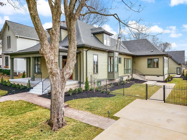 view of front of house featuring covered porch and a front lawn