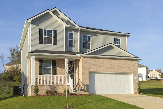 view of front facade featuring central air condition unit, a front yard, a garage, and a porch