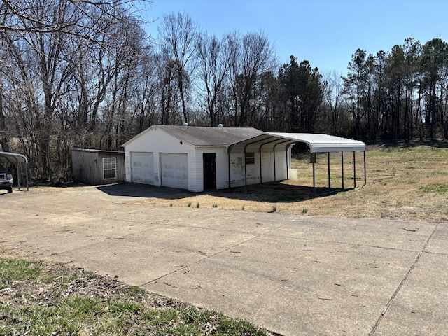 view of outbuilding featuring a carport and an outdoor structure