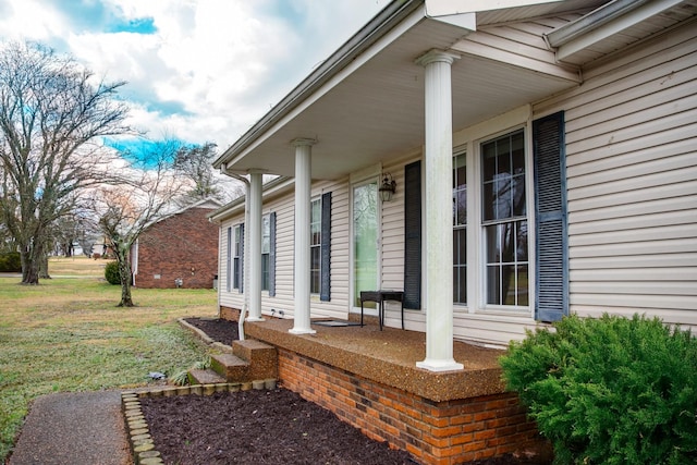 exterior space featuring a lawn and a porch