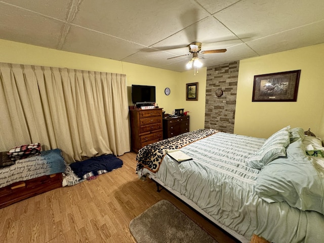 bedroom featuring hardwood / wood-style floors and ceiling fan