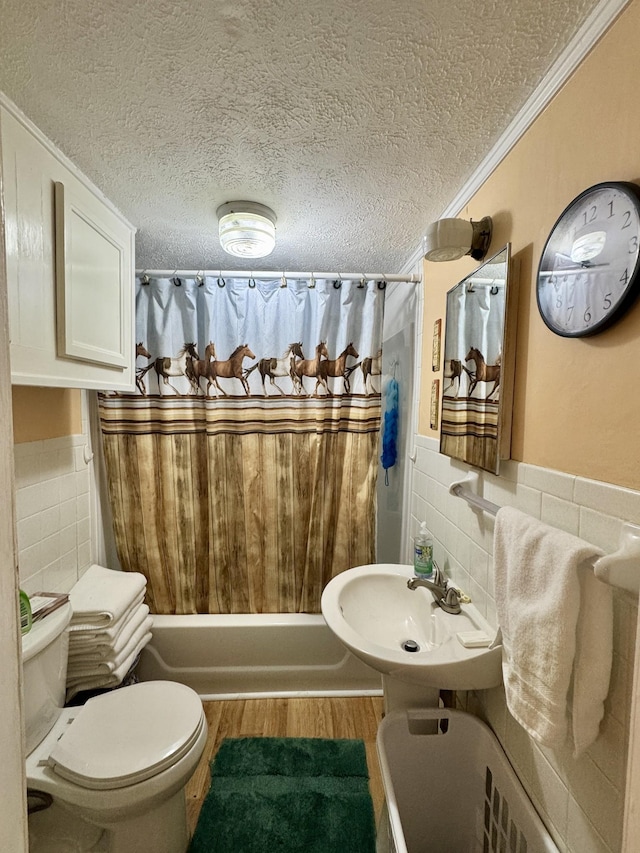 full bathroom featuring shower / tub combo with curtain, tile walls, crown molding, and a textured ceiling