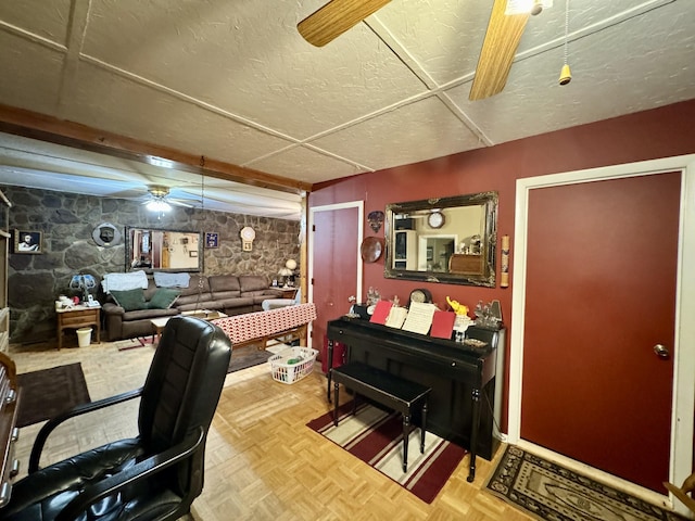 home office with parquet floors and ceiling fan