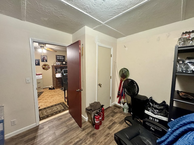 interior space featuring dark hardwood / wood-style floors and a textured ceiling