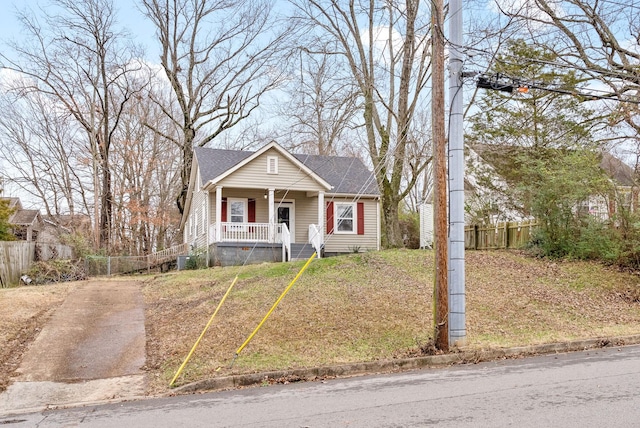 bungalow-style house featuring a front yard and a porch