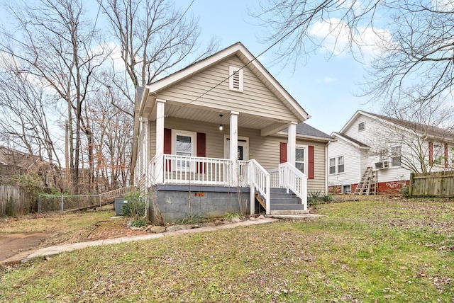 bungalow-style house with a front lawn and a porch