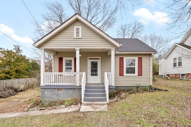 bungalow-style house featuring a front lawn and a porch