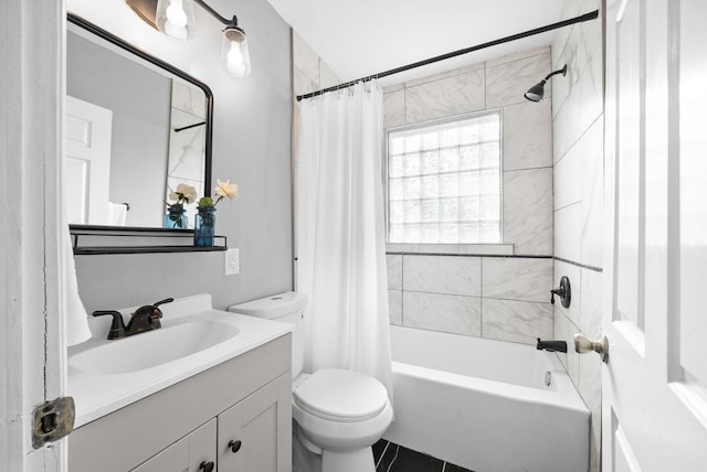 full bathroom featuring toilet, vanity, and shower / bath combo